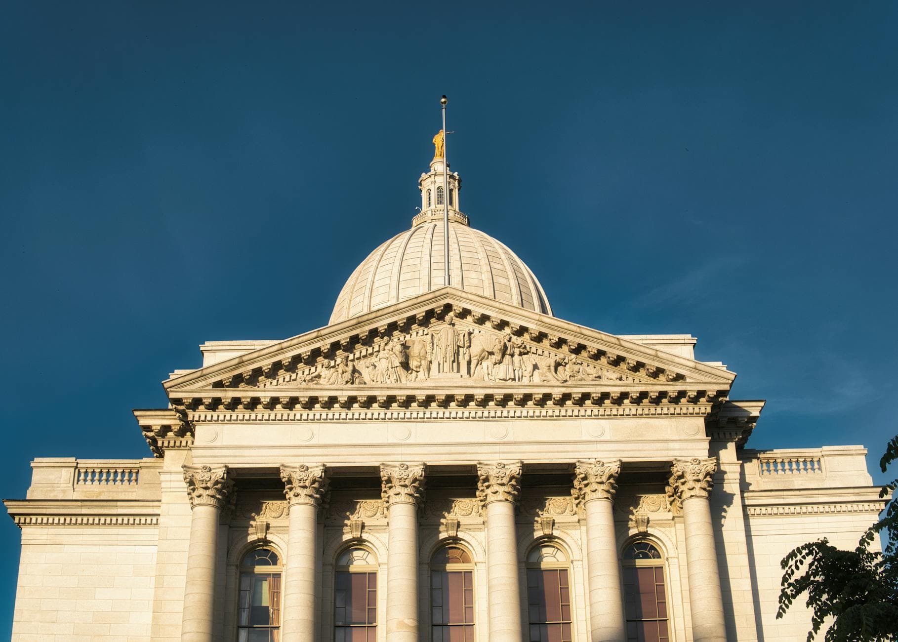 Stunning view of Wisconsin State Capitol building against a clear blue sky in Madison.