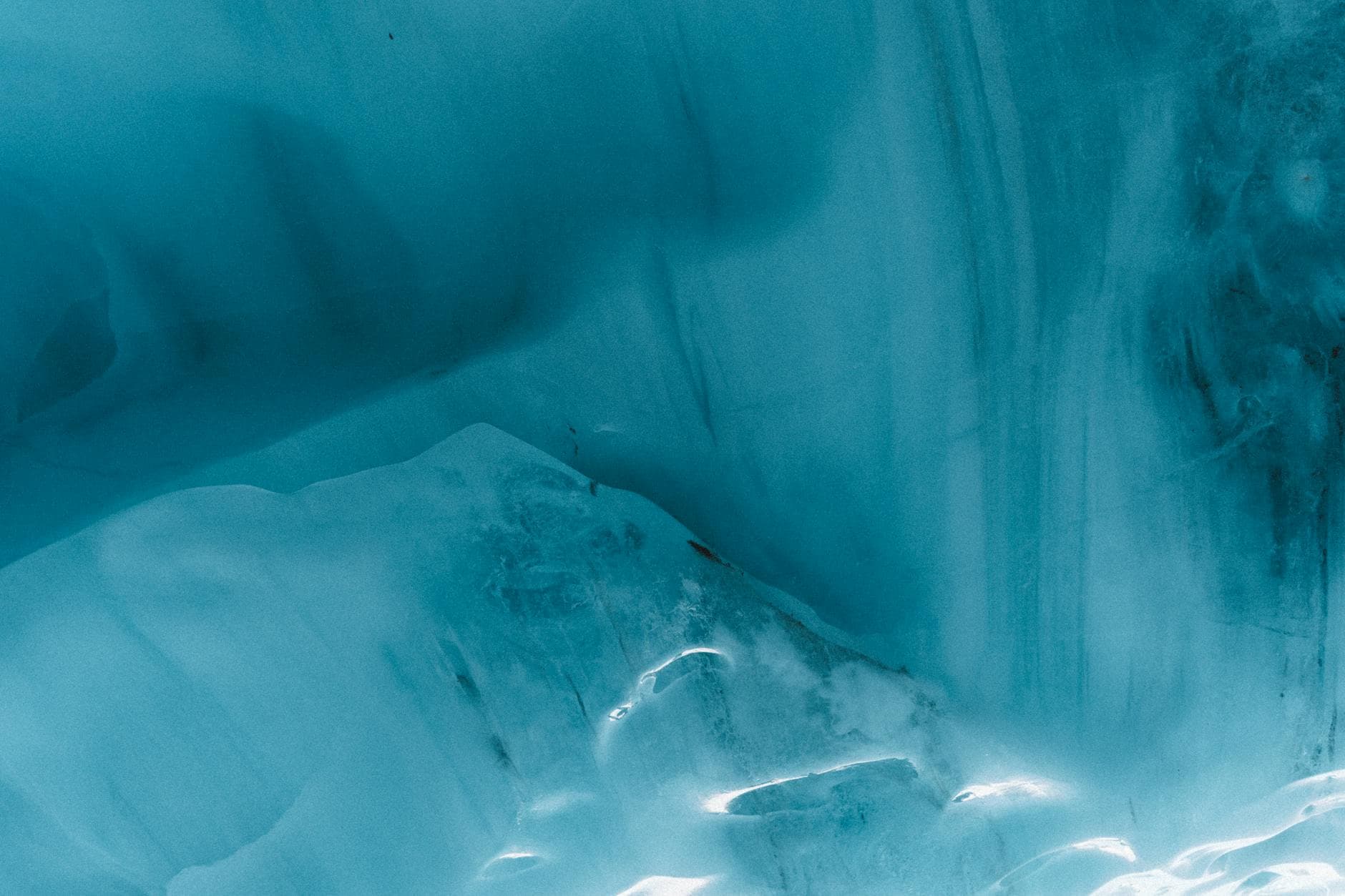 Explore the breathtaking beauty of ice formations in an enchanting glacier cave in Whistler, BC, Canada.