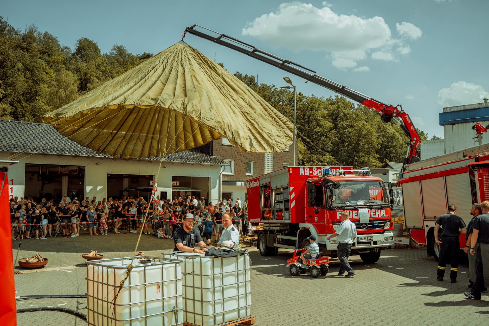 A vibrant community event showcasing firetruck operations in Morsbach, NRW, Germany.