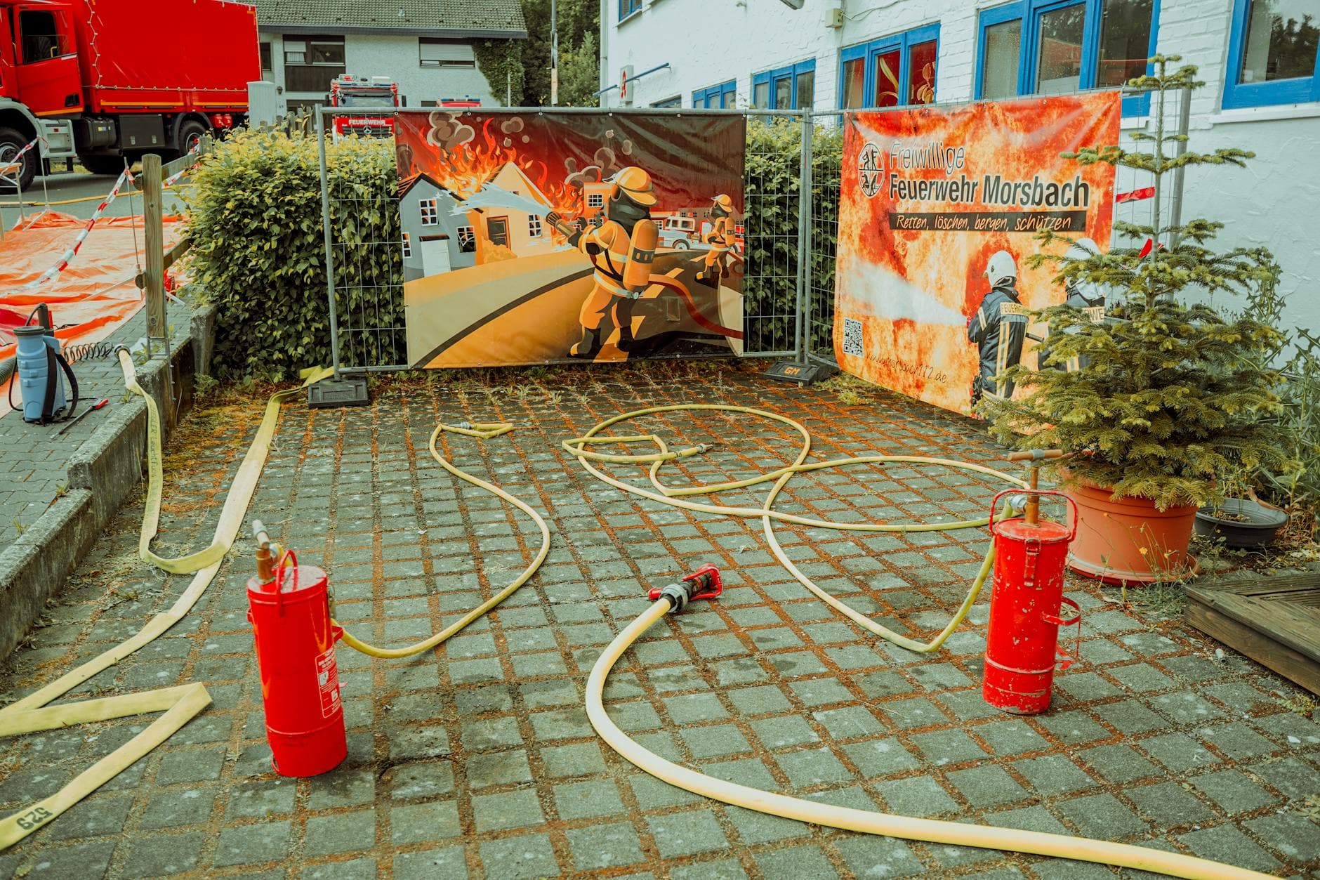 A vibrant display of firefighting equipment and posters in Morsbach, Germany.