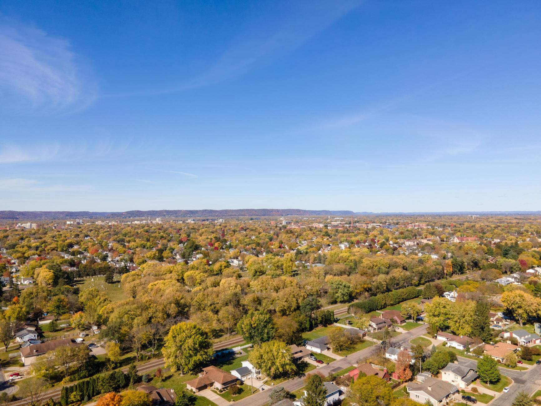 A vibrant aerial image showcasing residential areas and fall foliage in La Crosse, Wisconsin.