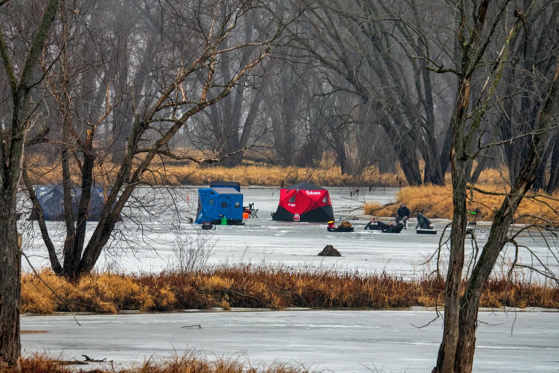 A captivating winter ice fishing scene on a frozen lake in Nelson, Wisconsin with colorful tents.
