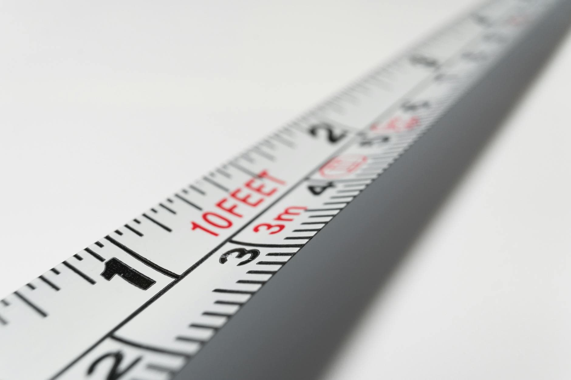 Detailed close-up of a measuring tape indicating measurements in feet and meters.