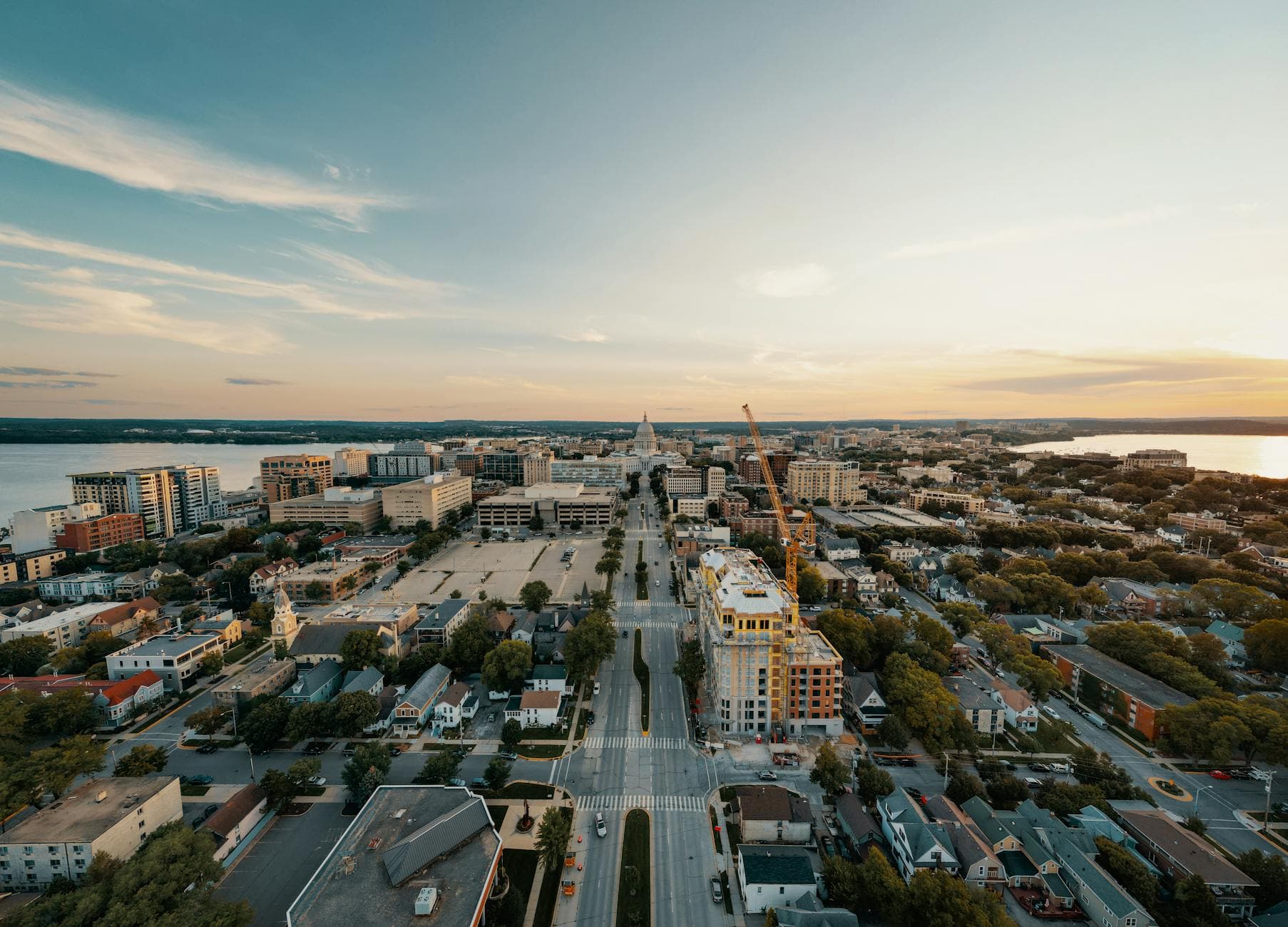 Stunning aerial view of Madison, Wisconsin cityscape at sunset with the Capitol building.