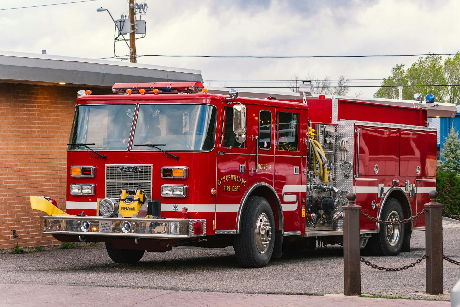 Classic red fire truck from Williams, Arizona Fire Dept parked outdoors.