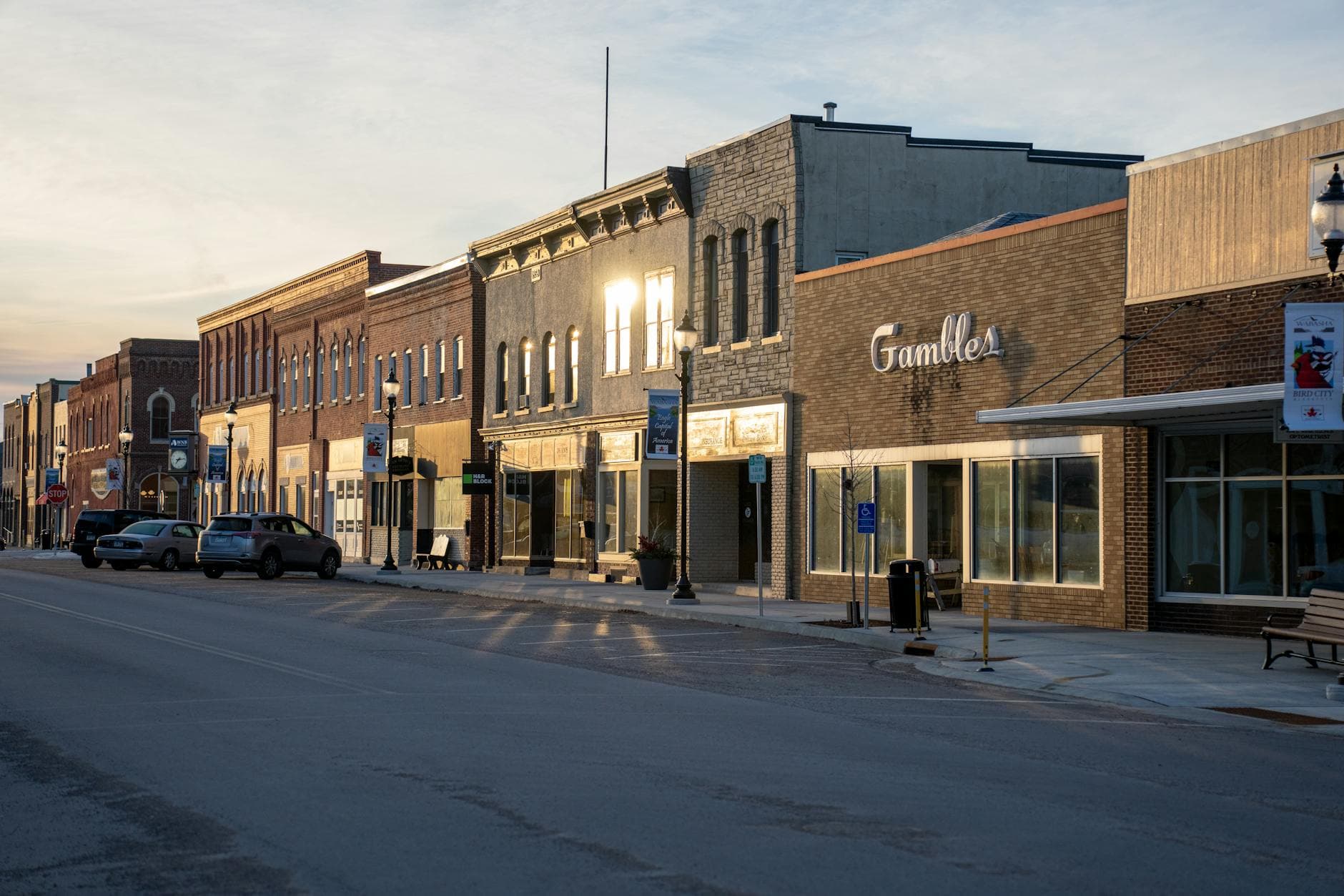 Quaint historic downtown Wabasha, Minnesota, at sunset with charming storefronts.