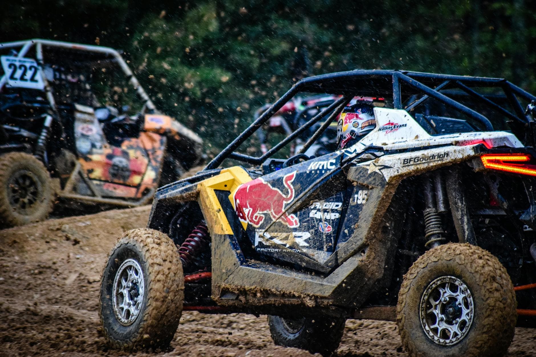 Action-packed off-road buggy race showcasing thrilling maneuvers on a muddy track in Tennessee.
