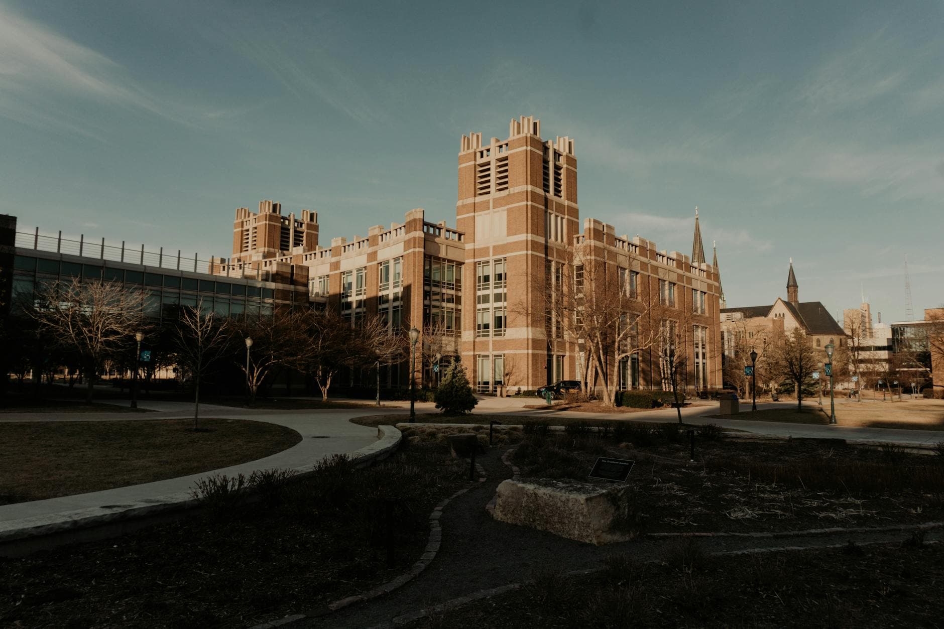 A historic campus building with classic architecture in Milwaukee, Wisconsin, under a clear sky.