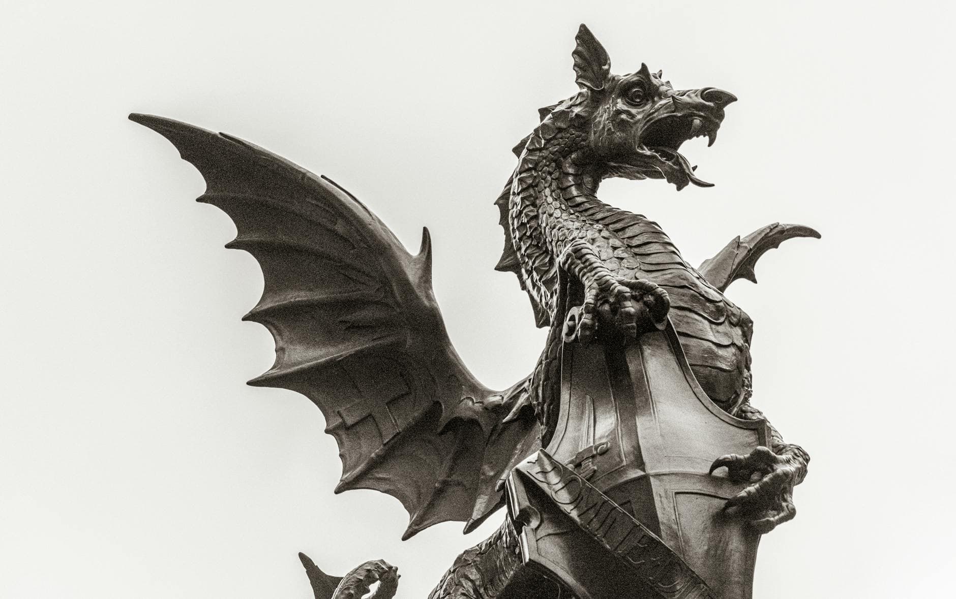 Captivating monochrome photo of the dragon statue at Temple Bar, London.