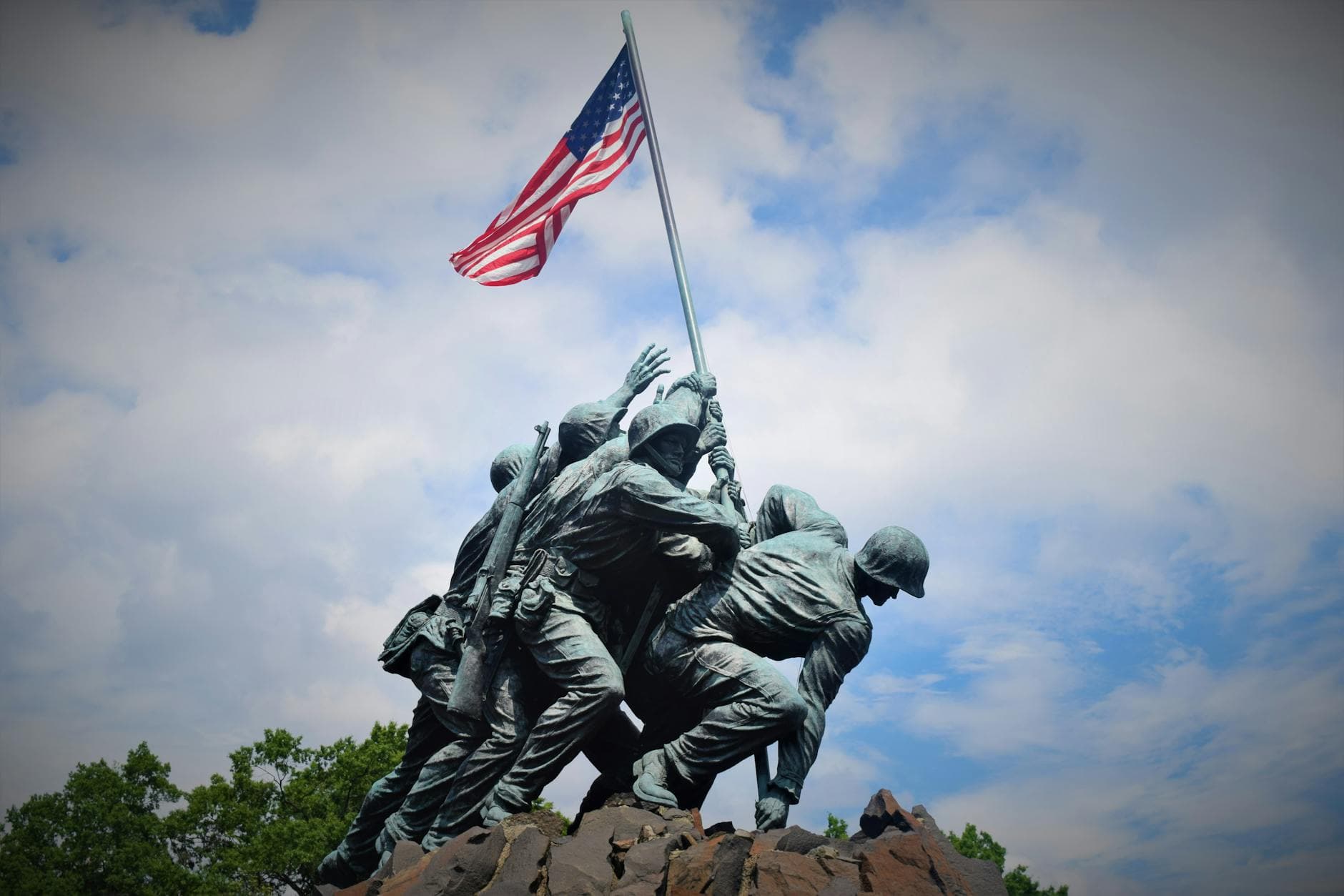 Iconic Iwo Jima Memorial depicting soldiers raising the American flag against a blue sky.
