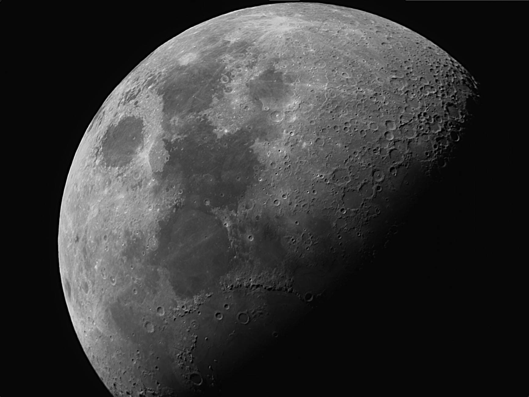 Close-up image of the moon's surface highlighting its craters and texture.