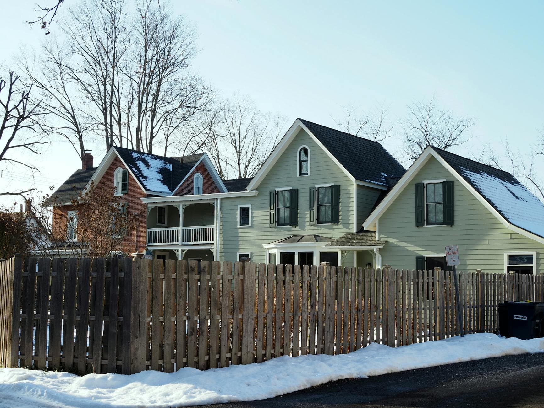 Charming snow-covered historic homes in Doylestown, Pennsylvania during winter.