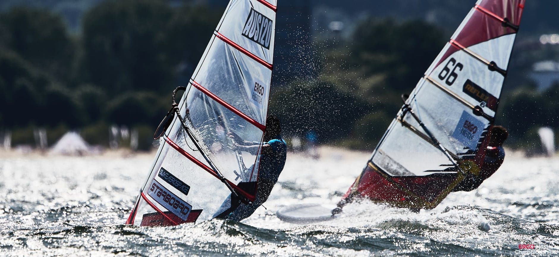 Exciting windsurfing competition in Sopot, Poland with athletes in motion on the sea.